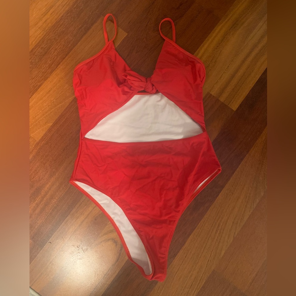 bright red one piece swimsuit with stomach cut out - no wear